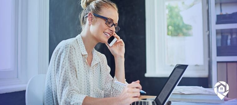 Real estate agent making client calls and managing leads on a laptop – effective communication for real estate success.