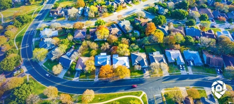 Aerial view of suburban real estate neighborhood — building a million-dollar real estate business.