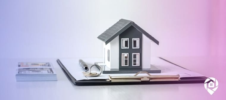 A house on top of a clipboard full of papers that are a guide for those looking to invest in properties.