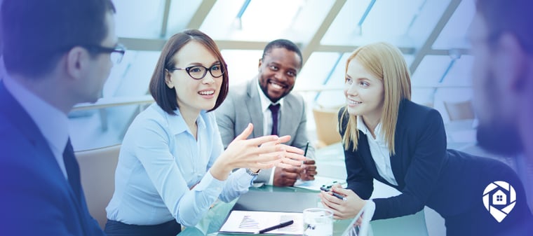 Real estate professionals building trust through strategic conversations during a team meeting.