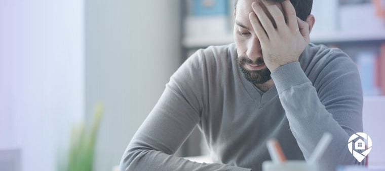Frustrated real estate investor learning from costly mistakes.