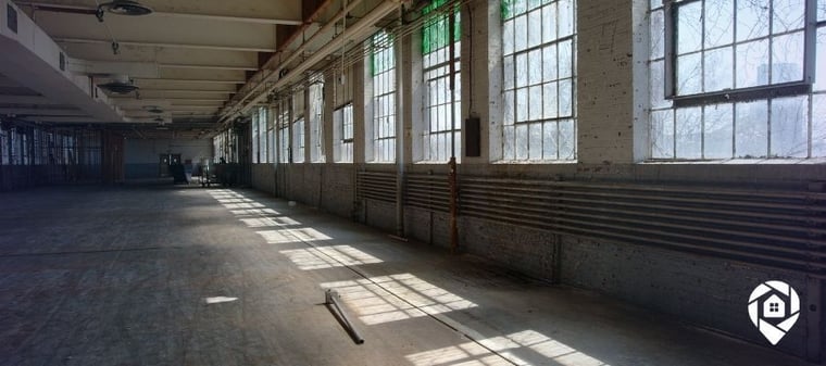 Vacant commercial building interior before redevelopment into a small business center.