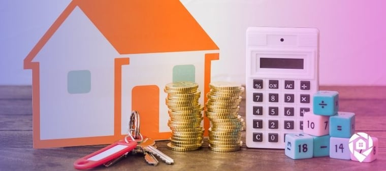 Stacks of coins and a calculator with a house to determine the cost basis of a rental property,