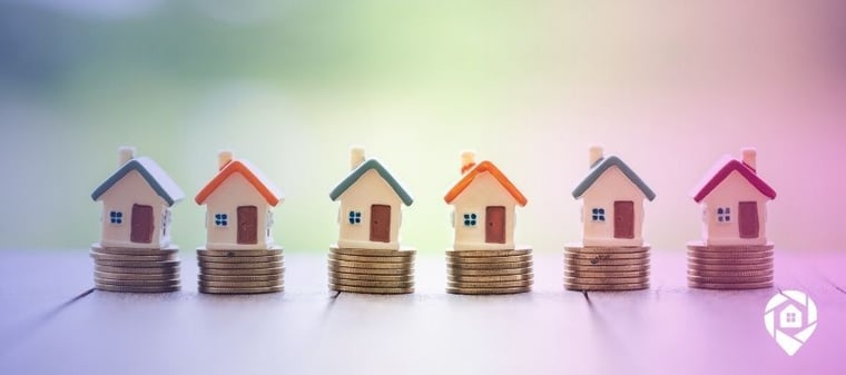 A line of tiny houses on coins to symbolize How to Find Profitable Investment Properties for Sale
