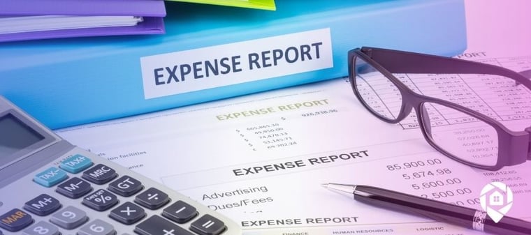 An expense report binder on top of real estate operating expense sheets.