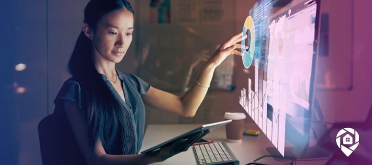 Woman at a computer with software popping off the screen for our real estate investing software blog.
