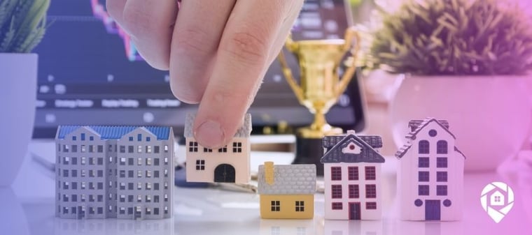Line up of properties on a table to symbolize a real estate competitive market analysis