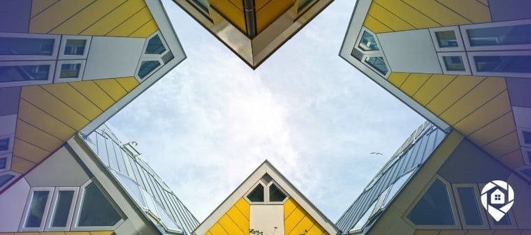 Modern yellow cube houses symbolizing creative real estate investing strategies like novation and hidden value deals.