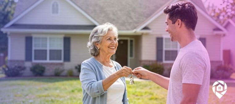 Senior homeowner handing house keys to a younger buyer
