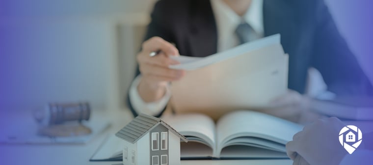 Disposition agent reviewing real estate documents during a wholesale property transaction.