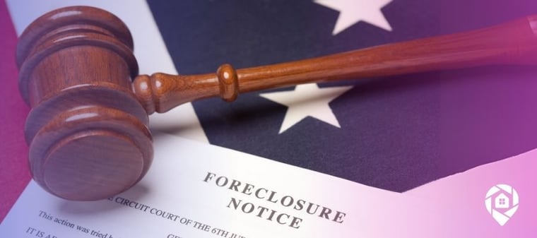 A gavel over a foreclosure notice on top of a US flag.
