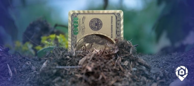 Hundred dollar bill buried in soil symbolizing land investing profits.