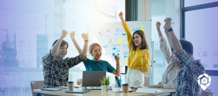 Real estate team celebrating a successful off-market deal through relationship-based investing.