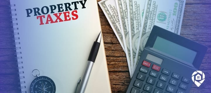 Notebook labeled property taxes next to cash and a calculator, representing property tax in Sacramento CA